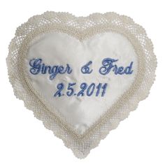 a heart shaped pillow with the words ginger and fried on it's side, in blue