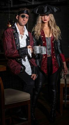 a man and woman dressed in pirate costumes