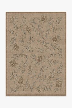 a beige rug with flowers and leaves on it