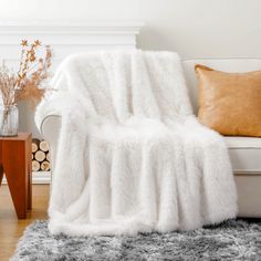 a couch with a white blanket on top of it