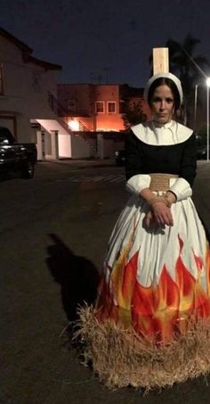 a woman in a dress with flames on it