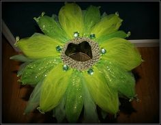 a large green flower with lots of beads on it