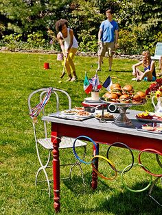 a table with food on it in the grass