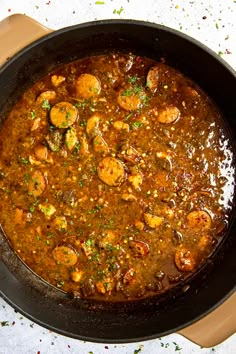 a pan filled with food sitting on top of a table