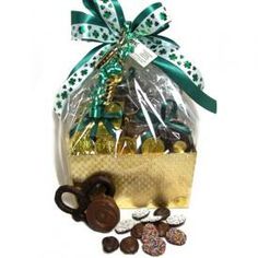 a gift basket filled with chocolates and pretzels for st patrick's day