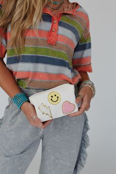 So cute! Take your boho style to the next level with the adorable Smile In Style Pouch—the perfect accessory for any occasion! Convenient pouch style bag with eye-catching details Faux leather material with so CUTE Smiley face, lightning bolt and heart patch designs Convenient zipper pouch closure *Due to lighting and differences in monitors, actual colors may vary slightly from what appears online. Model is 5'8" and wearing a size One Size. Approximate measurements are as follows: ONE SIZE: Len Trendy White Pouch Clutch, Trendy White Cosmetic Bag, Trendy White Everyday Pouch, Trendy White Clutch For Everyday Use, Trendy White Pouch For Daily Use, Trendy White Clutch Pouch, White Casual Zipper Pouch, Trendy Cream Clutch For Everyday Use, Casual White Zipper Pouch