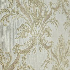 an ornate wallpaper pattern in gold and white