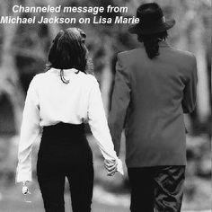 a man and woman walking down a street holding hands with the caption, michael jackson on his back