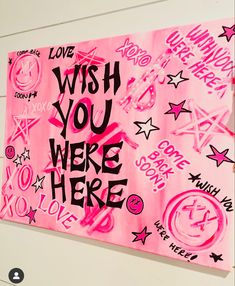 a pink sign with writing on it that says, wish you were here love and hate