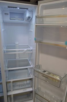 an empty refrigerator with the door open