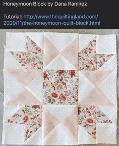 an image of a quilt block with flowers on it