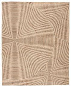 a beige rug with circles on it