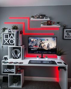 a desk with a computer, keyboard and mouse on it in front of some shelves