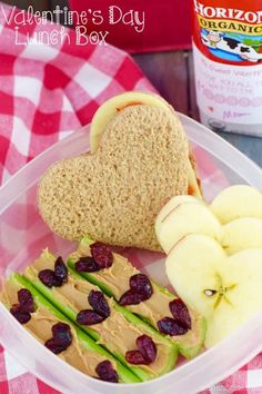 a heart shaped sandwich with peanut butter and fruit