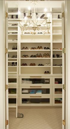 the closet is full of shoes and other items