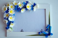 a white frame with blue and yellow flowers on it