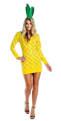 a woman in a yellow pineapple costume posing for the camera with her hands on her hips