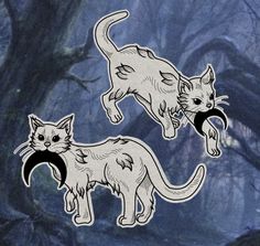 two stickers depicting cats in the woods