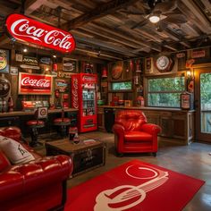 a living room filled with red couches and coca - cola machines