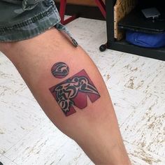 a person with a tattoo on their leg