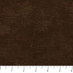 a ruler that is next to a brown fabric