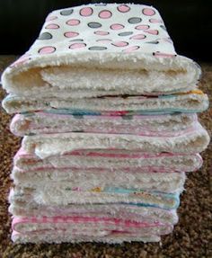 a stack of towels sitting on top of a carpet