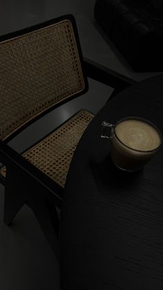 a table with a chair and a cup on it