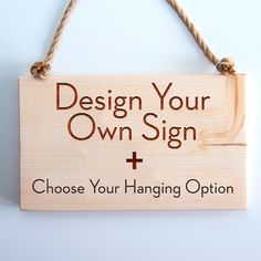 a wooden sign that says design your own sign and choose your hanging option