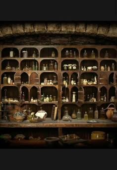 an old wooden shelf filled with lots of bottles and jars on it's sides