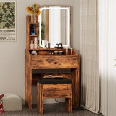 a wooden vanity table with a mirror and stool