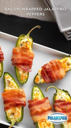 bacon wrapped jalapeno peppers on a white plate with the words philadelphia written above them