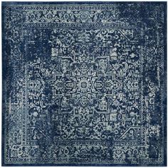 a blue and white rug with an intricate design