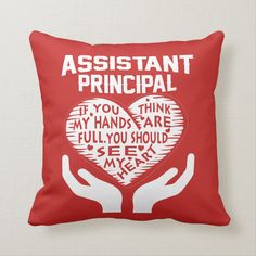 a red pillow that says, day care teacher if you think my hands are full