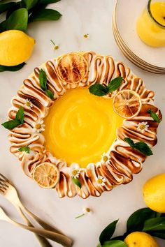 a lemon custard tart on a white table surrounded by sliced lemons