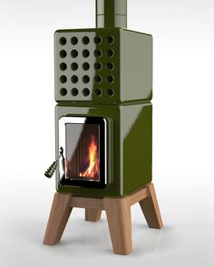 a green stove sitting on top of a wooden stand