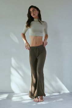 So soft Out From Under knit lounge pant in a cozy relaxed flare silhouette. Designed in a soft & stretchy jersey knit featuring a low-rise, elasticated drawstring waistline and kick-flare hem for an effortless vibe. Only at Urban Outfitters. Features Out From Under Easy Does It Cozy flare lounge pant Low rise lounge pant Soft and stretchy jersey knit Cozy soft feel Low rise waistline with drawstring tie Fitted through waist, hips and thighs Slim flare fit Full length Pull-on construction UO excl