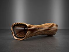 a wooden bench made out of strips of wood