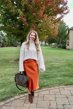 Rust slip skirt for fall Dark Orange Skirt Outfit, Rust Color Skirt Outfit, Orange Floral Skirt Outfit, Rust Skirt Outfit Fall, Rust Orange Skirt Outfit, Orange Skirt Outfit Fall, Orange Skirt Outfit Ideas, Satin Skirt Outfit Fall, Silk Midi Skirt Outfit