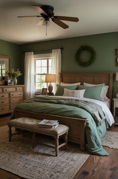 a bed room with a neatly made bed next to a window and a ceiling fan