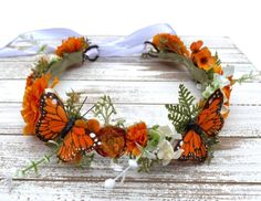 This whimsical orange butterfly crown is in the twisted vine style and adorned with berry vines, assorted florals, and beautiful monarch butterflies. Two loops in back tie with satin ribbon white or ivory. Available in 3 sizes: -Baby (6M-2 years old) Beautiful photo prop or birthday crown -Child (2-12 years old) Sweet for flower girls -Adult (13 years and up) Bridal party, engagement pictures, special photo sessions... Beautiful flower crown to add whimsy to your wedding party.  Gorgeous photo p Monarch Birthday Party, Monarch Butterfly Wreath, Monarch Butterfly Birthday Party, Alexander Kallus, Monarch Butterfly Wedding, Butterfly Flower Crown, Wedding Decorations Diy Centerpiece, Crown Photo, Birthday 12