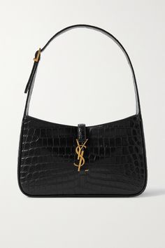 SAINT LAURENT's shoulder bag has a sleek, minimal silhouette that calls to mind coveted '90s styles. Made in Italy from black croc-effect leather, it's adorned with the house's signature 'YSL' plaque and has plenty of space for your phone, keys and cardholder.  You can easily adjust the buckled strap to your preferred drop. Ysl Shoulder Bag, Prom Bag, Luxury Bags Collection, Girly Bags, Fancy Bags, Pretty Bags, Designer Shoulder Bags, Saint Laurent Bag, Cute Bags