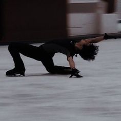 a man is skateboarding down the street