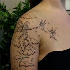 a woman with a tattoo on her shoulder and the image of a fairy holding a star