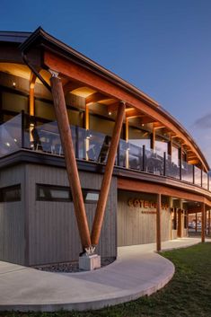 This microbrewery building is entirely made of glued laminated timber. This distinctive architecture gives the beams different profiles. The connectors hidden in the wood are therefore adapted to each of the beams. The exterior round glulam columns are reminiscent of ship masts. Photo credit : Stéphane Groleau. Wood Structure: Art Massif Beam And Column Structure, Wood Architecture Design, Mass Timber Structure, Timber Buildings Architecture, Ship Building Architecture, Heavy Timber Architecture, Wood Structure Detail, Column Design Exterior Architecture, Exterior Column Design