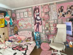 a bedroom with hello kitty decorations on the walls