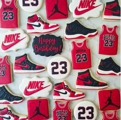 decorated cookies are arranged in the shape of basketball shoes and sneakers with numbers on them