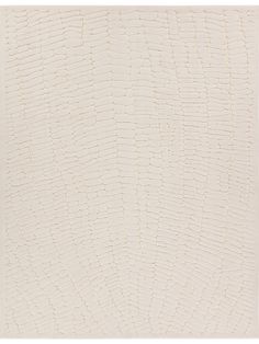 a white rug with an abstract design on the top and bottom part of it's surface