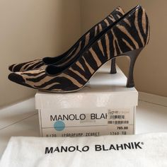 Manolo Ipara Pump In Brown And Tan Zebra Print In Pony Hair, Size 38. Wood Grain Heel. Note Damage To Front Tips, Heels And Wear On Soles. A Gorgeous Shoe Goes From Jeans To Work. Heel Approx 3”. Well Loved (Adding A Rubber Sole Would Make A Big Difference). With Dust Bag. Shoes Manolo Blahnik, Blahnik Shoes, Manolo Blahnik Shoes, Pony Hair, Gorgeous Shoes, Zebra Print, Manolo Blahnik, Wood Grain, Shoes Women Heels