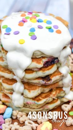 a stack of pancakes covered in white frosting