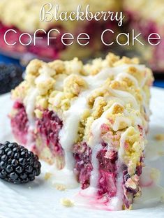 blackberry coffee cake on a white plate with blackberries